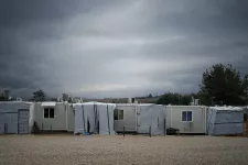 Refugee camp with barracks and tents